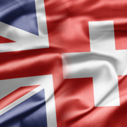 Crasi fra le bandiere della Confederazione Svizzera e il Regno Unito