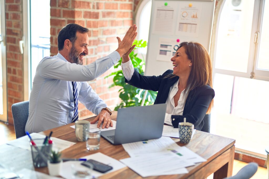 man and woman at work Photo by krakenimages on Unsplash