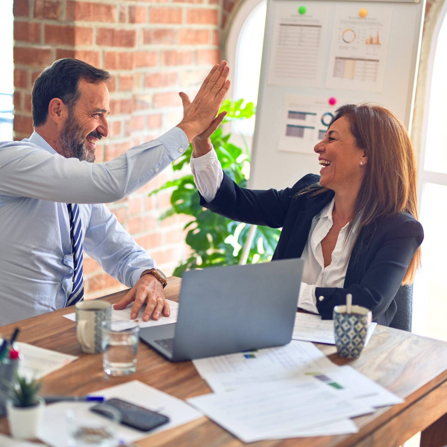 man and woman at work Photo by krakenimages on Unsplash