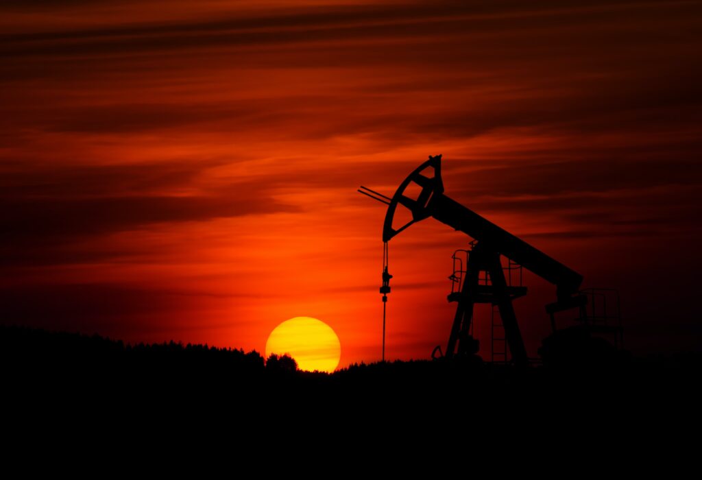 Pump-jack mining crude oil with the sunset Photo by Zbynek Burival on Unsplash