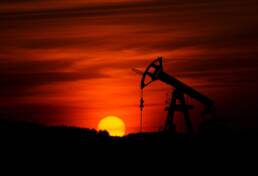 Pump-jack mining crude oil with the sunset Photo by Zbynek Burival on Unsplash