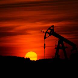 Pump-jack mining crude oil with the sunset Photo by Zbynek Burival on Unsplash