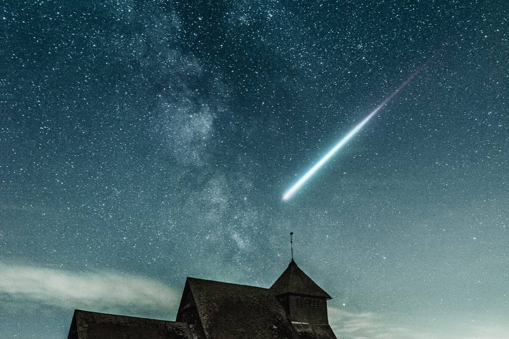 Night sky over the church Photo by Alexander Andrews on Unsplash