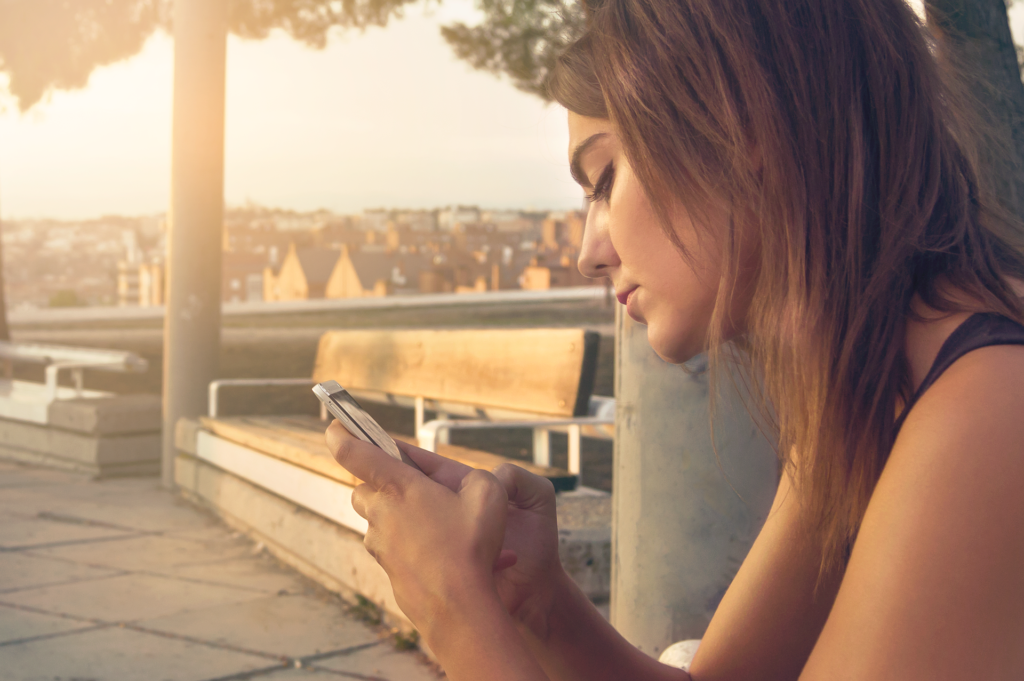 A young lady with a smartphone Image by Pexels from Pixabay